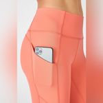 Fabletics Oasis PureLuxe High-Waisted Twist 7/8 Legging- Coral Haze Photo 2