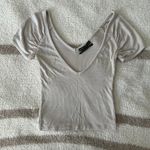 Urban Outfitters out from under beige v-neck top Photo 1