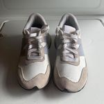 Nike  New Balance Photo 1