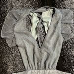 Altar'd State flowy, A-line maxi dress with a tiered skirt and a deep V-neckline or open-back design. Photo 7