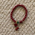 Red Beaded Bracelet With Chinese Design and Small Green Bead Photo 3