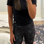 Lululemon Wunder Train High Rise Tight 25” in Logo Flourish Black Foil Photo 0