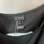 Enfocus Studio   Black and white dress with polka dots and lace detail at hem Photo 7