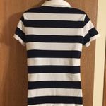 IZOD  women’s cute navy and white striped golf‎ shirt. Size M. EUC Photo 1