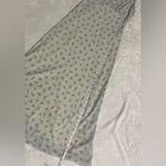 Alyn Paige Long Dress: Elegant 90’s sleeveless dress features A-line silhouette, perfect for any occasion. The delicate fabric drapes beautifully, providing a flattering fit. This timeless piece can be dressed up or down, making it a versatile addition to your wardrobe. Ideal for summer gatherings or evening events, it's a must-have for style enthusiasts. Photo 7