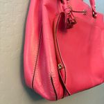 Kate Spade bright coral pink colored tote bag with snap closure and tassels Photo 5