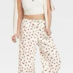 Colsie White Pajama Pants with Red Floral Design Medium Photo 0