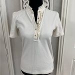 Tory Burch Emily Ruffled Pique Polo Shirt in Ecru. Photo 3