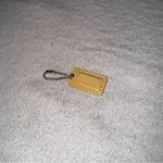 Coach  tan/ yellow cream Keychain Tag Photo 1
