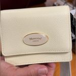 Moncrief London Italian leather wallet in a light color cream or yellow. Photo 2