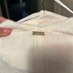 Ivanka Trump  Cardigan short in front longer in back Photo 1