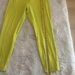 Lululemon women's high-rise leggings in neon yellow. Stretchy, Size 12 Photo 1