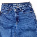 American Eagle high-waisted asymmetrical waist blue denim straight leg mom jeans Photo 1