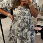 Olivaceous black & white patterned babydoll dress Photo 1