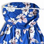 Blue print strapless romper with pockets. Size medium Photo 1