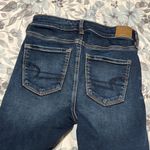 American Eagle  Next Level Stretch Dark Wash Distressed Patched Jeans 4 S… Photo 5
