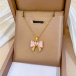 Pink Enamel Bow Pendant Necklace Gold Tone Chain Crystal Center NWT Photo 1