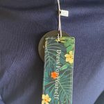 Blooming Jelly NWT--ASYMMETRICAL BLUE FLORAL AND WHITE LACE MAXI DRESS-SIZE XL Gorgeous white lace top with a blue floral flowy skirt, backwards with cross straps, skirt has elastic back with a side zipper, lining is a navy blue under skirt, 95% cotton and 5% spandex, dress is brand new with tags, size xl Measurements: Bust: armpit to armpit 18 inches  Waist: side to side 16-18 inches  Length: back of skirt-shoulder seam to bottom is 60 inches Photo 6