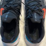 Nike Black Athletic Shoes with orange, blue and purple back Photo 5