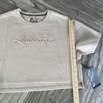 Alphalete NEW  Woman’s  ELMTS Short SLEEVE Crop - Tan ,Size Medium Photo 4