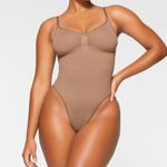 SKIMS NEW Seamless Sculpt Thong Bodysuit in Sienna Size XS Has Small Hole Photo 0