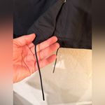 Nike Sportswear Essential
Women's Oversized UV Woven Coaches size Large black Photo 12