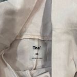 Aritzia tna baby pink flared high waisted leggings size Xs Has some staining a Photo 1