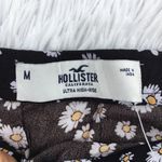 Hollister high waisted floral/daisy print Girl’s ultra mini skirt size Medium Photo 1