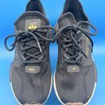 Adidas  NMD Black and Gold Sneakers Photo 0