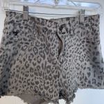 These KanCan jean shorts feature a chic gray color with a stylish leopard print design, offering a trendy and comfortable fit. The elastic waistband ensures ease of wear, while the soft fabric provides all Photo 1