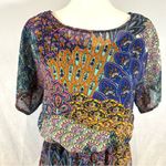 Forever 21 Beautiful colors peacock feather print dress size small Photo 1
