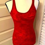 Happening in the present || Red tank Photo 0