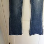 Women’s Medium Wash MidRise Slight Distress Babybell Jeans sz medium Blue Photo 2