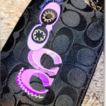 Coach  Signature Corner Zip Wristlet Bag Black Jacquard Fabric Purple Graphics Photo 1