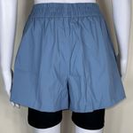 We Wore What  Windbreaker Biker Short in Dusty Blue Photo 4