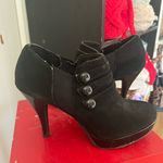 Unlisted Stiletto with button down sides. Black suede and patten leather Photo 0