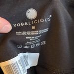 Yogalicious ‎ medium black yoga pants. With see through pattern along leg- 2207 Photo 2