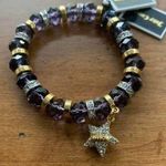 Juicy Couture  Stretch Purple Beaded Bracelet with Dangling Crystal Star Charm Photo 0
