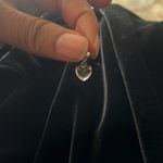 The Great Tiny little clear heart charm.  for a thin necklace. Photo 0