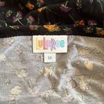 LuLaRoe NWT SS black w/ multi colored flowers cute high/low hem and flowy skirt Photo 10