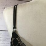 Daisy Fuentes  giraffe push-up bra Photo 2