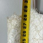 Jenny Yoo Collection Lace Mini Dress in white/gold in size 12. Photo 11