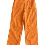 SheIn orange pants with hip cut out Photo 1