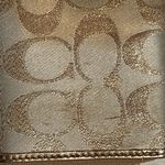 Coach  signature Charlie C zip around wallet gold with purple interior Photo 10