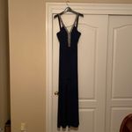 The brand is JS Boutique, it’s a size 10, and it’s color is navy blue. Photo 5
