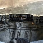 Bebe Jeans frayed edge mini denim Jean skirt Women’s Size 26 Photo 3