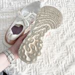 Nike  React Infinity Run Flyknitv Running Shoe in Sail Metallic Copper Photo 9