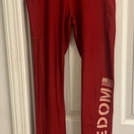 Under Armour  Women’s Red Freedom Leggings Photo 0