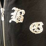 BCBGMAXAZRIA BCBGMaxAzaria black full zip bling rhinestone spell out hooded sweatshirt medium Photo 1