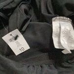 New. Black one shouldered one piece swimsuit. Size 10. Retails $164 Photo 6